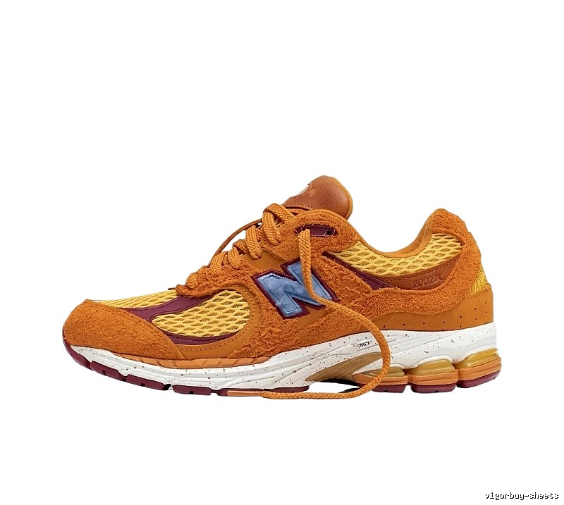 New Balance 2002R retro-style orange shoes